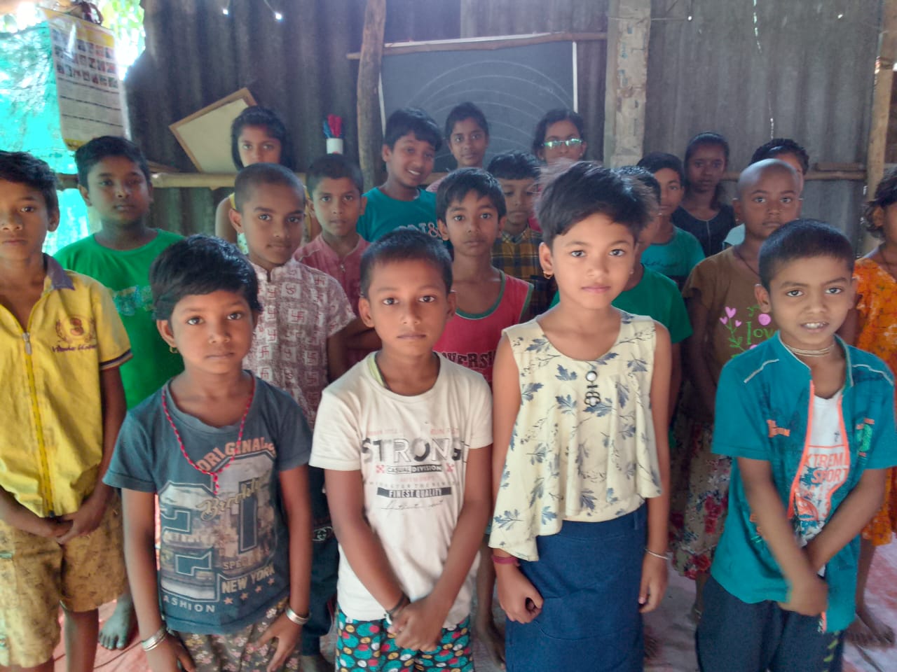 Children gathered side by side at a community activity